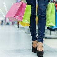 Photo of woman carrying shopping bags